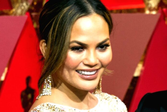 Chrissy Teigen suffers hilarious wardrobe malfunction at charity event